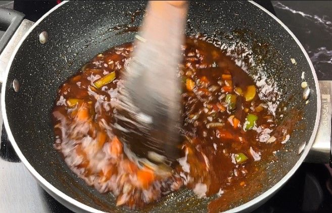 Step 2.2: Add a small amount of water to prevent the sauces from sticking to the pan or burning
