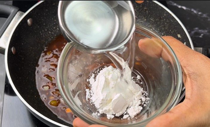 Step 2.1: In a small bowl, mix a teaspoon of corn flour with water to make a slurry