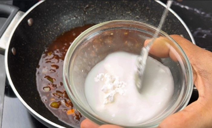 Step 2.2: In a small bowl, mix a teaspoon of corn flour with water to make a slurry