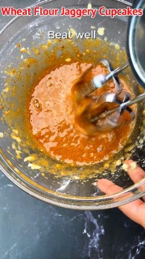 Step 1.2: Add jaggery powder and beat well until it mixes thoroughly