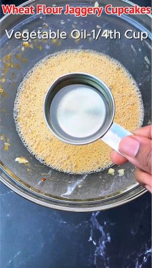 Step 1.1: Pour in vegetable oil and vanilla essence, then beat well until fully combined