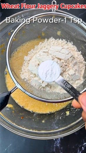 Step 1.3: Place a sieve on top of the bowl and add wheat flour, baking powder, baking soda, and cinnamon powder