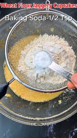 Step 1.4: Place a sieve on top of the bowl and add wheat flour, baking powder, baking soda, and cinnamon powder