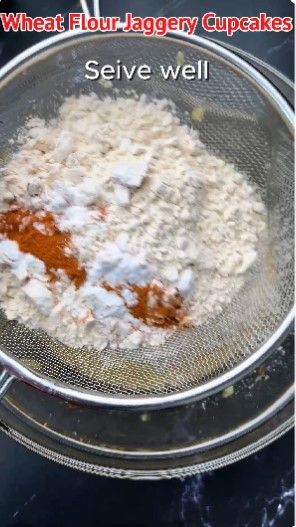 Step 1.6: Place a sieve on top of the bowl and add wheat flour, baking powder, baking soda, and cinnamon powder