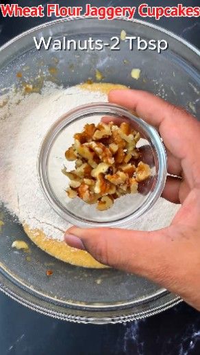 Step 1.1: Add chopped walnuts to the mixture and gently fold until well mixed