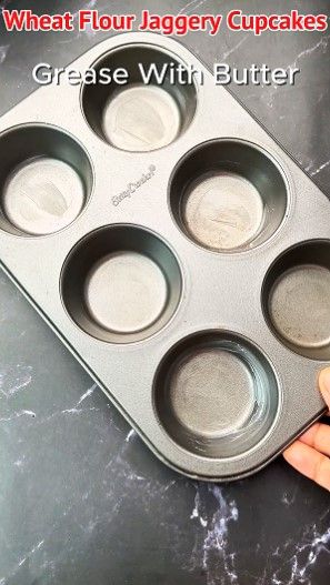Step 1.1: Take a muffin tray, grease it with butter, and place liners inside