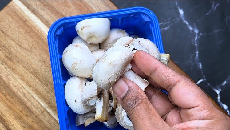 Step 1.2: Chop the mushrooms in half and set them aside