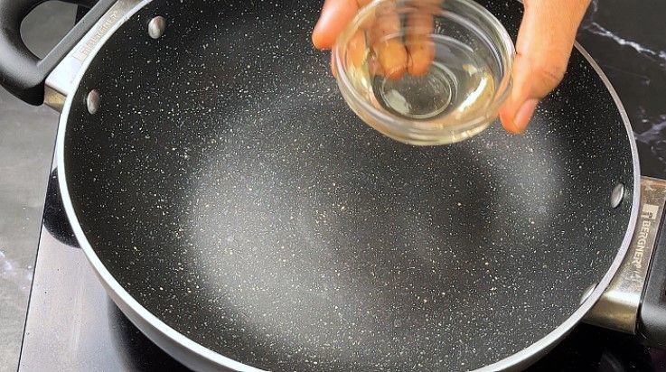 Step 3.1: In another pan, add oil on medium flame