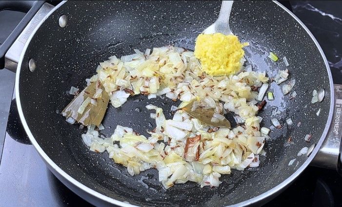 Step 5.1: Stir in ginger-garlic paste and sauté until the raw smell disappears