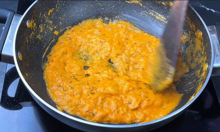 Step 6.3: Add this mixture to the pan and sauté until the oil starts to separate from the curry