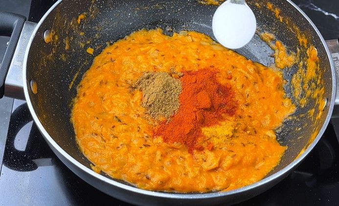 Step 7.4: Add turmeric powder, red chili powder, coriander powder, and salt