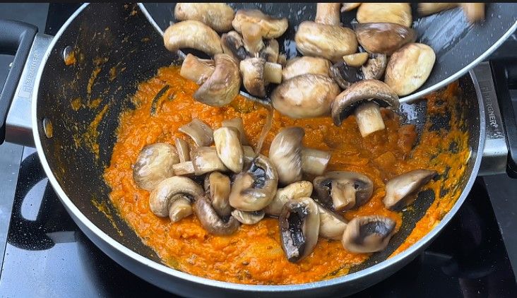 Step 8.1: Add the sautéed mushrooms to the pan and mix well