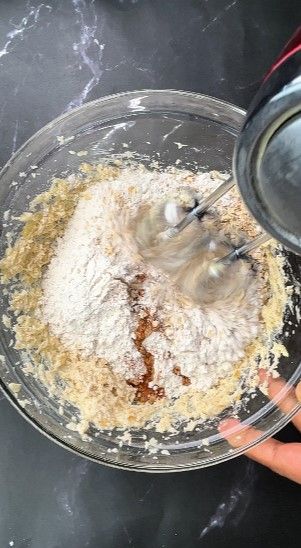Step 1.7: Add oats, maida, baking soda, cinnamon powder, salt, and [vanilla extract](https://amzn