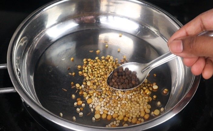 Step 1.6: Add chana dal, urad dal, coriander seeds, cumin seeds, methi, black pepper, and dried red chilies