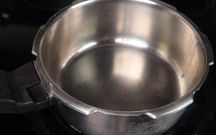 Step 2.1: Add the washed dals to a [pressure cooker](https://amzn