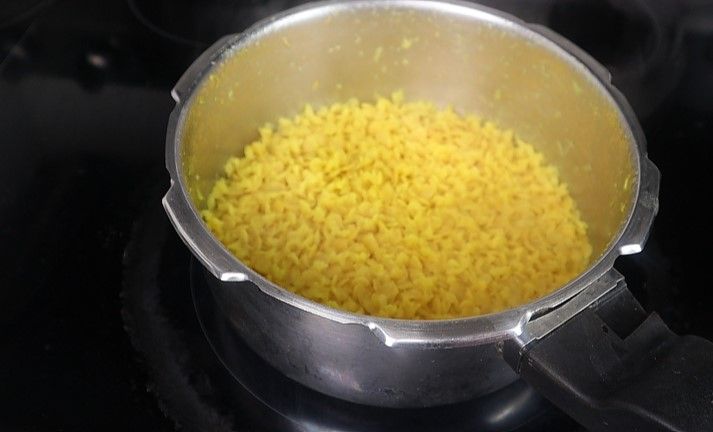 Step 2.1: Once the pressure releases naturally, open the cooker and mix the cooked dal to a smooth consistency