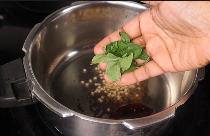 Step 3.5: Add mustard seeds and cumin seeds, urad dal, dried red chili, and curry leaves