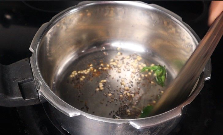 Step 3.6: Add mustard seeds and cumin seeds, urad dal, dried red chili, and curry leaves