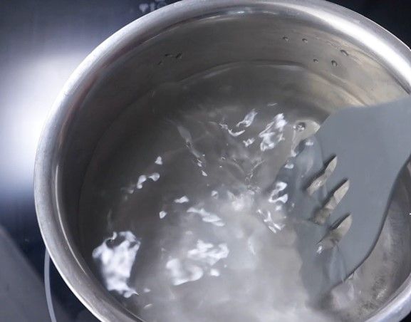 Step 1.2: In a bowl on medium flame, add enough water and salt, and bring to a rolling boil
