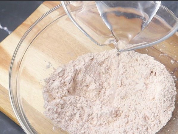 Step 2.1: Gradually add water to make a thick batter that coats the back of a spoon