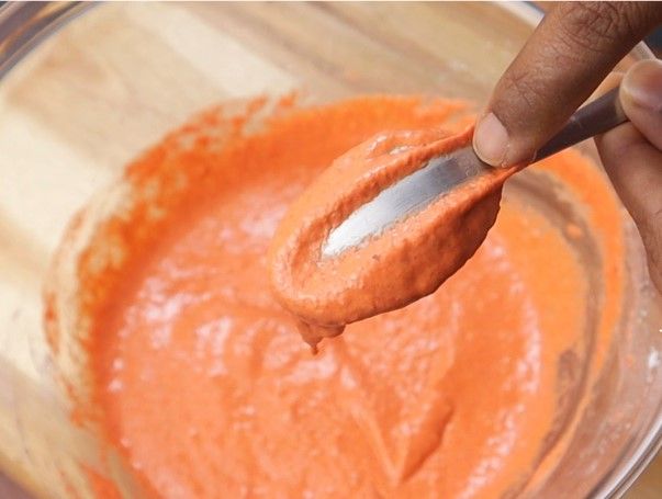 Step 2.3: Gradually add water to make a thick batter that coats the back of a spoon