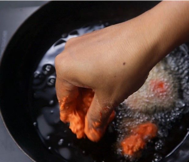 Step 3.2: Deep fry the coated cauliflower in hot oil, adding them slowly to avoid overcrowding the pan