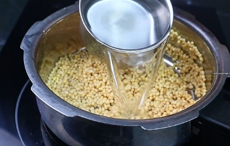 Step 1.5: Take 1/2 cup of urad dal, rinse well, and pressure cook it with sufficient water for 3-4 whistles or until soft and mushy