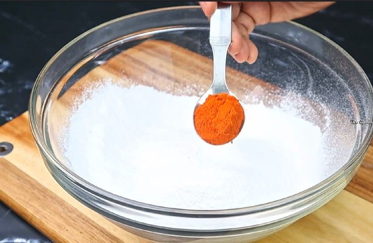 Step 2.3: In a mixing bowl, combine rice flour, mashed urad dal, butter or hot oil, carrom seeds, asafoetida, chili powder, and salt