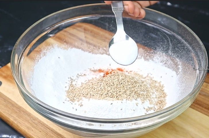 Step 2.6: In a mixing bowl, combine rice flour, mashed urad dal, butter or hot oil, carrom seeds, asafoetida, chili powder, and salt