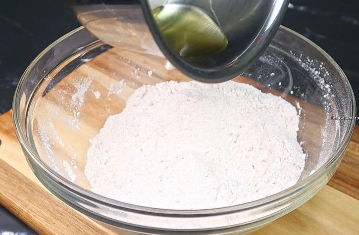 Step 2.8: In a mixing bowl, combine rice flour, mashed urad dal, butter or hot oil, carrom seeds, asafoetida, chili powder, and salt