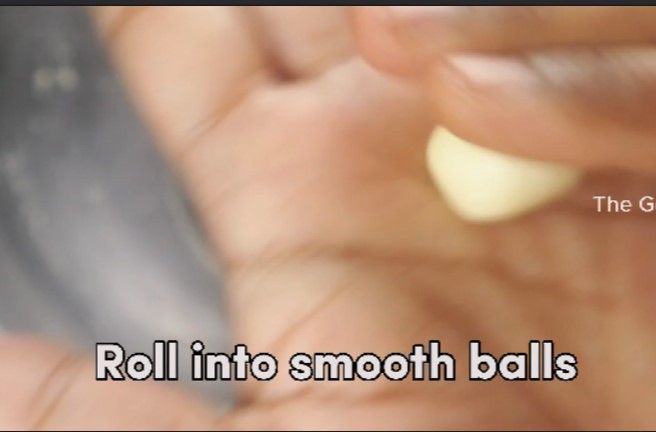 Step 2.2: Apply ghee to your hands and gently take a small amount of dough