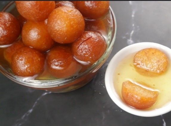 Step 2.2: Serve the gulab jamuns in a bowl, optionally with vanilla ice cream on top