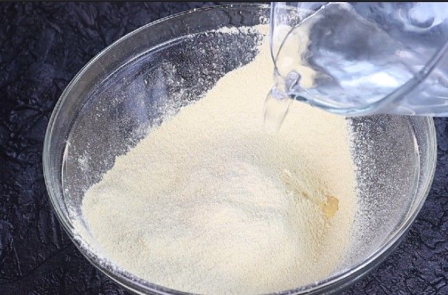 Step 1.1: Gradually add water at room temperature to make a lump-free, free-flowing batter