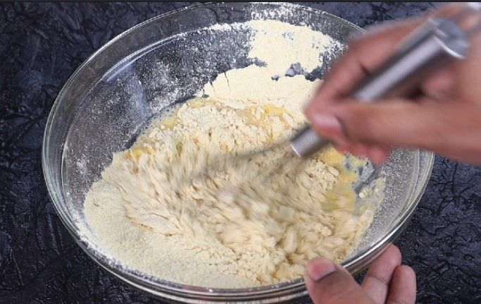 Step 1.2: Gradually add water at room temperature to make a lump-free, free-flowing batter
