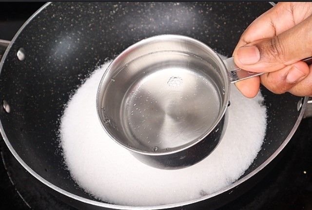 Step 3.3: In a pan over medium heat, add sugar and water