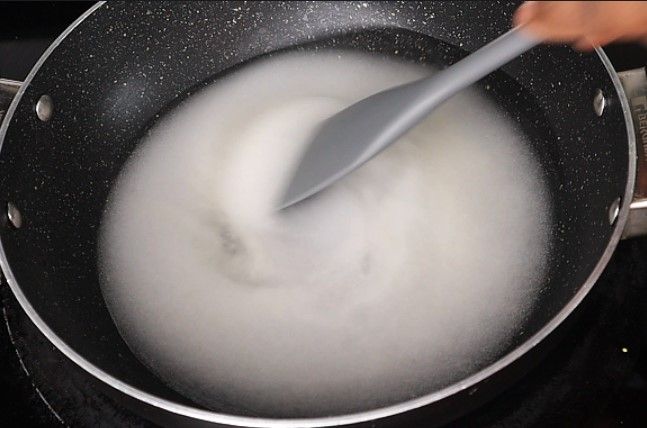 Step 3.4: In a pan over medium heat, add sugar and water