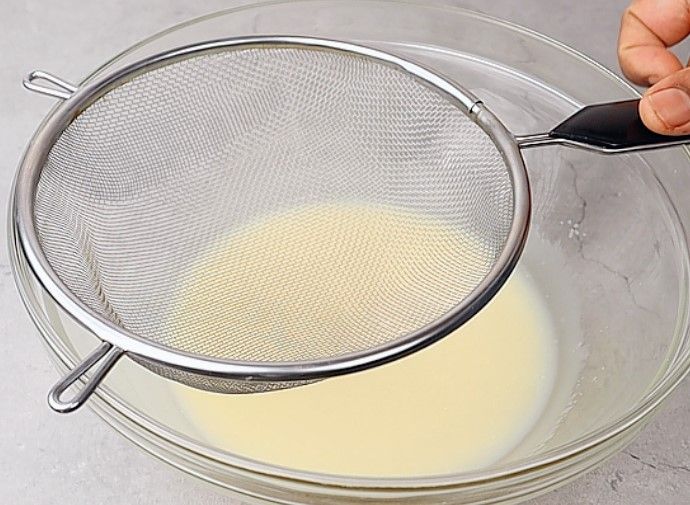 Step 1.1: Place a sieve over the bowl and add all-purpose flour, baking powder, baking soda, and salt