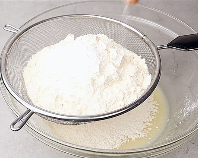Step 1.5: Place a sieve over the bowl and add all-purpose flour, baking powder, baking soda, and salt
