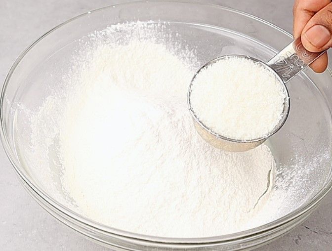 Step 1.1: Add desiccated coconut and milk to the mixture