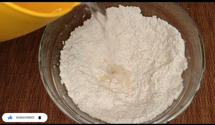 Step 1.3: Later add in water gradually and mix the mixture completely to form a nice non sticky dough