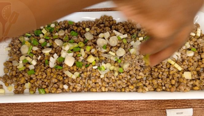 Step 1.1: Cut them into quarters,and later prepare the sauce that'll be use to stick together the parts , prepare the green grams altogether with the sliced spring onions, don't forget to add salt to taste