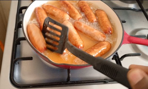 Step 1.4: Heat the Oil: Pour enough vegetable oil into a deep frying pan or wok to submerge the sausages about halfway
