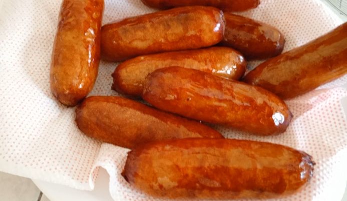 Step 1.1: Use tongs to remove the sausages from the oil and place them on a paper towel-lined plate to drain excess oil