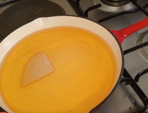 Step 2.2: Heat oil in a deep pan over medium heat