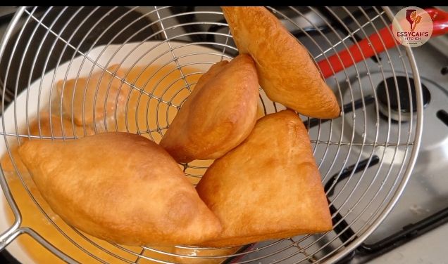 Step 2.1: Fry the pieces in hot oil until golden brown and puffed