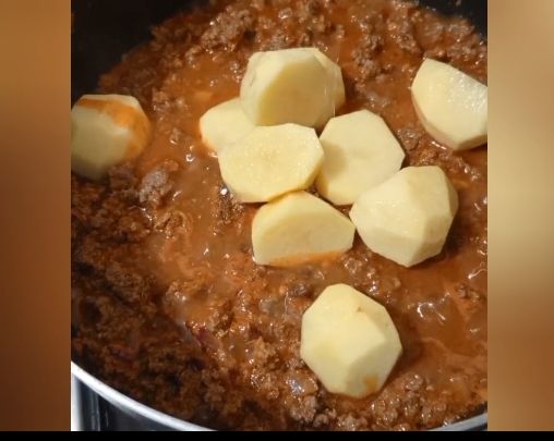 Step 2.1: Add the diced potatoes, royco cubes, royco mchuzi mix, turmeric powder, curry powder, and salt
