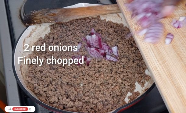 Step 1.2: Add the chopped onions and green peppers to the meat and cook until the vegetables are soft