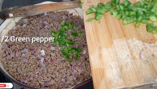 Step 1.1: Add the chopped onions and green peppers to the meat and cook until the vegetables are soft