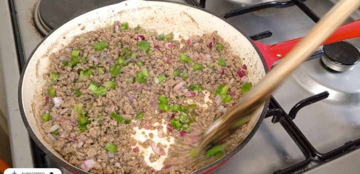 Step 1.4: Stir in the coriander leaves, beef cubes and salt, mixing well