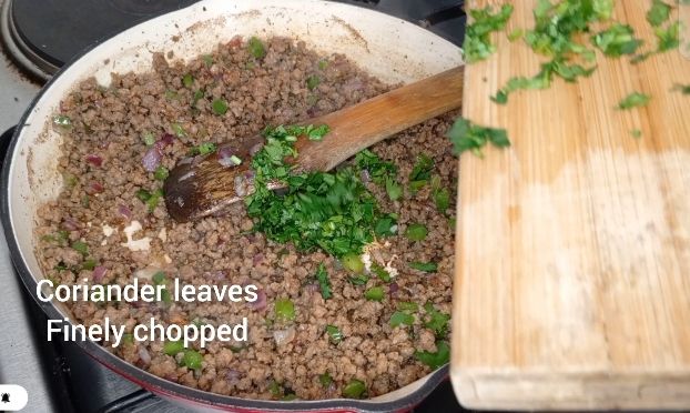 Step 1.2: Stir in the coriander leaves, beef cubes and salt, mixing well